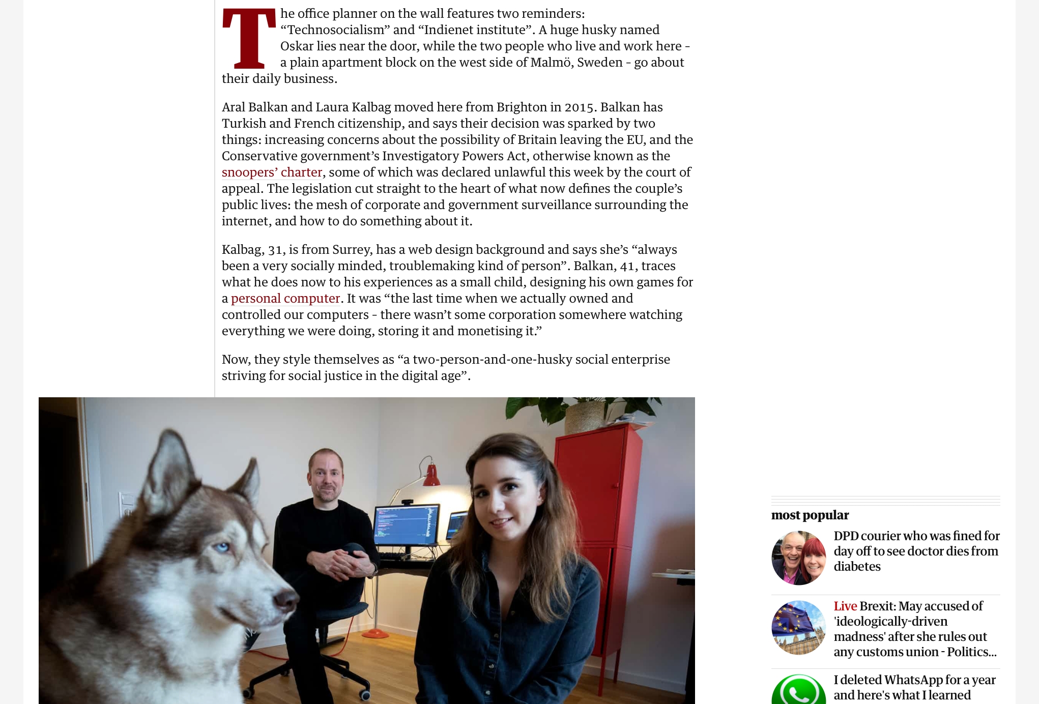 Screenshot of the beginning of the Guardian article featuring a photo of me, Aral and Oskar our dog in our office. Oskar is on the left looking into the distance. Aral and I are not posing.