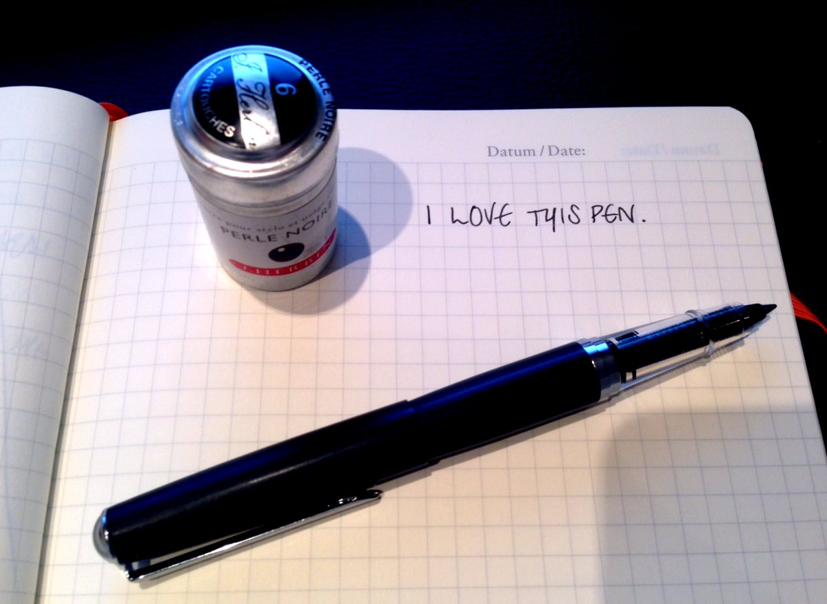 Pen, ink and 'I love this pen' handwritten in my notebook