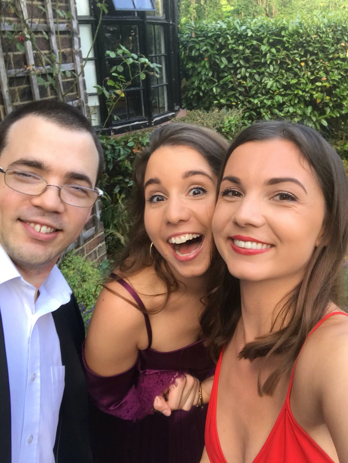 Me, my sister Jess and my brother Sam, dressed smartly and smiling for the camera in a slightly goofy way.