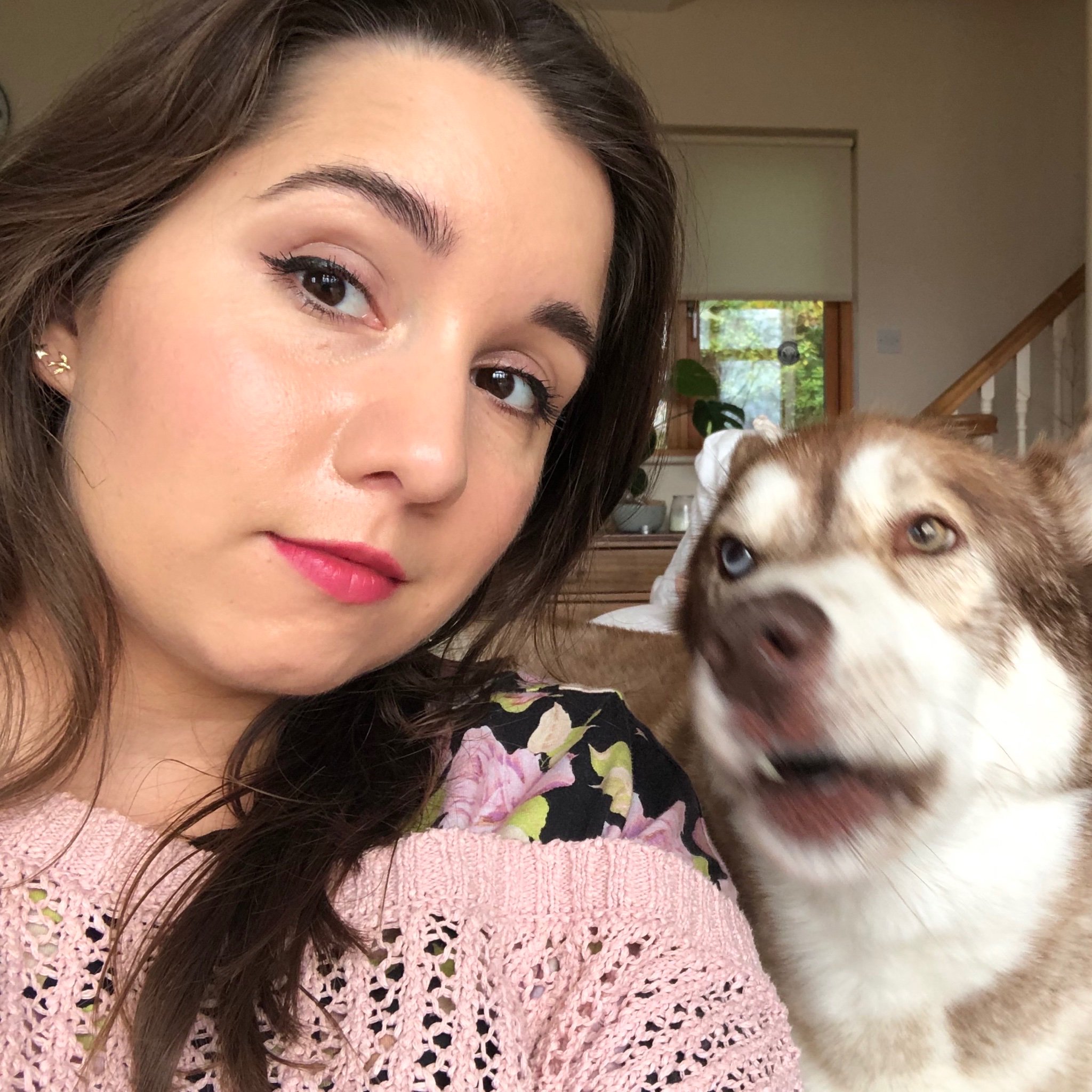 Selfie of me with my dog blurrily appearing over my shoulder to shout in my ear.