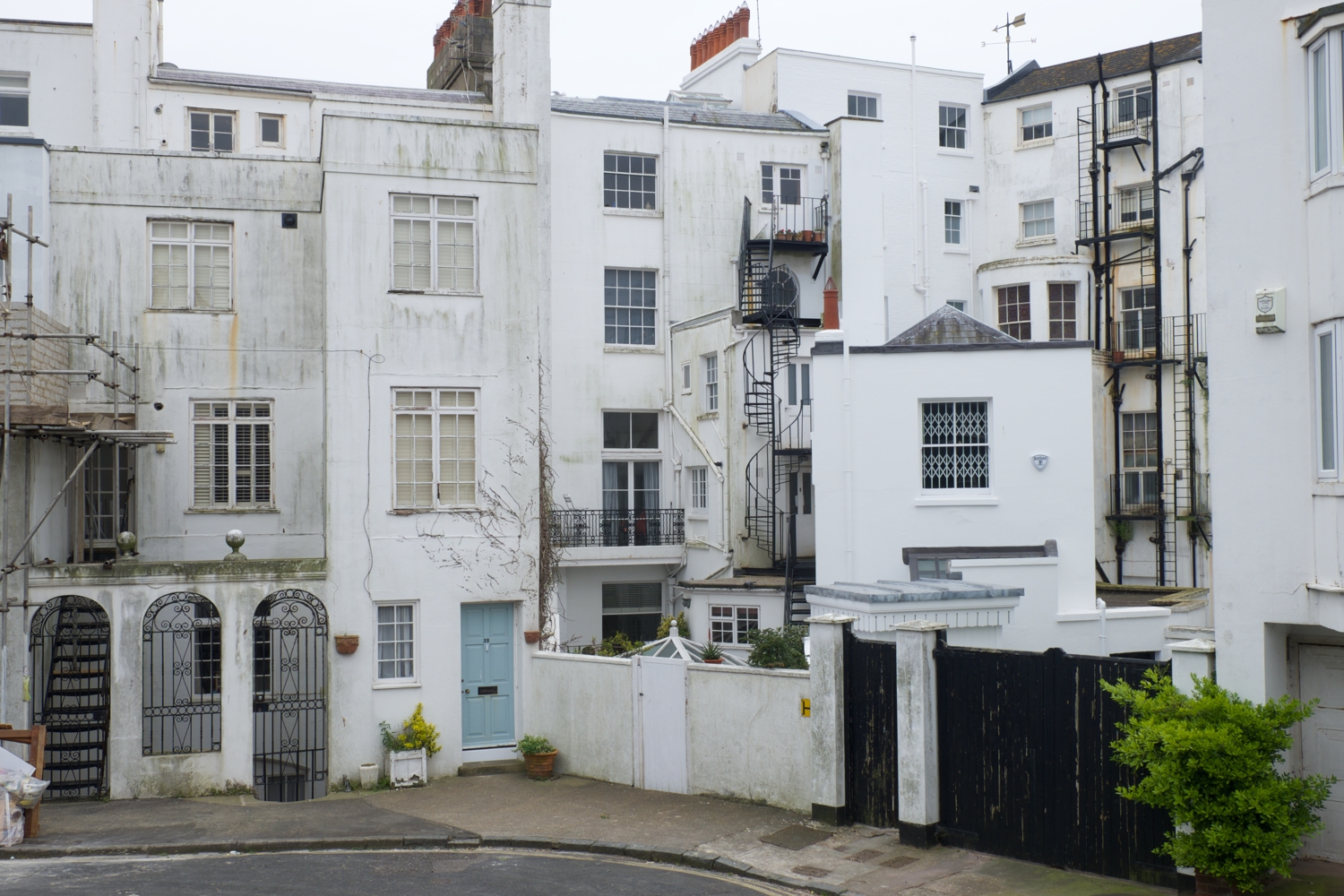 Photo of back of tall higgledy-piggledy regency buildings